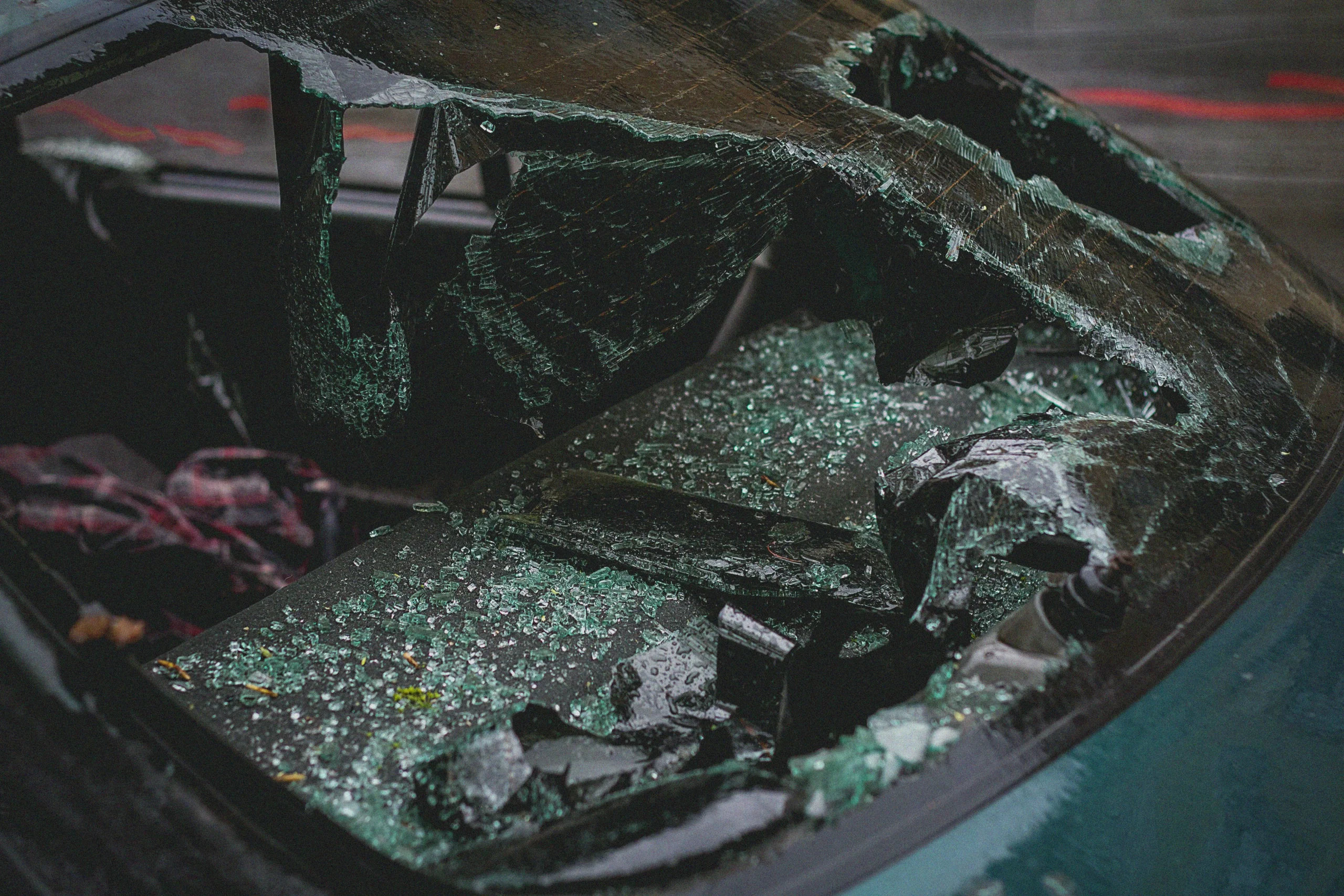 A broken windshield of a car.