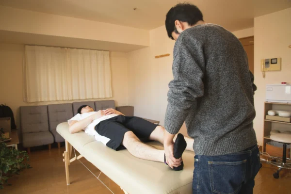 A patient receiving a chiropractic care from his trusted chiropractor in town.