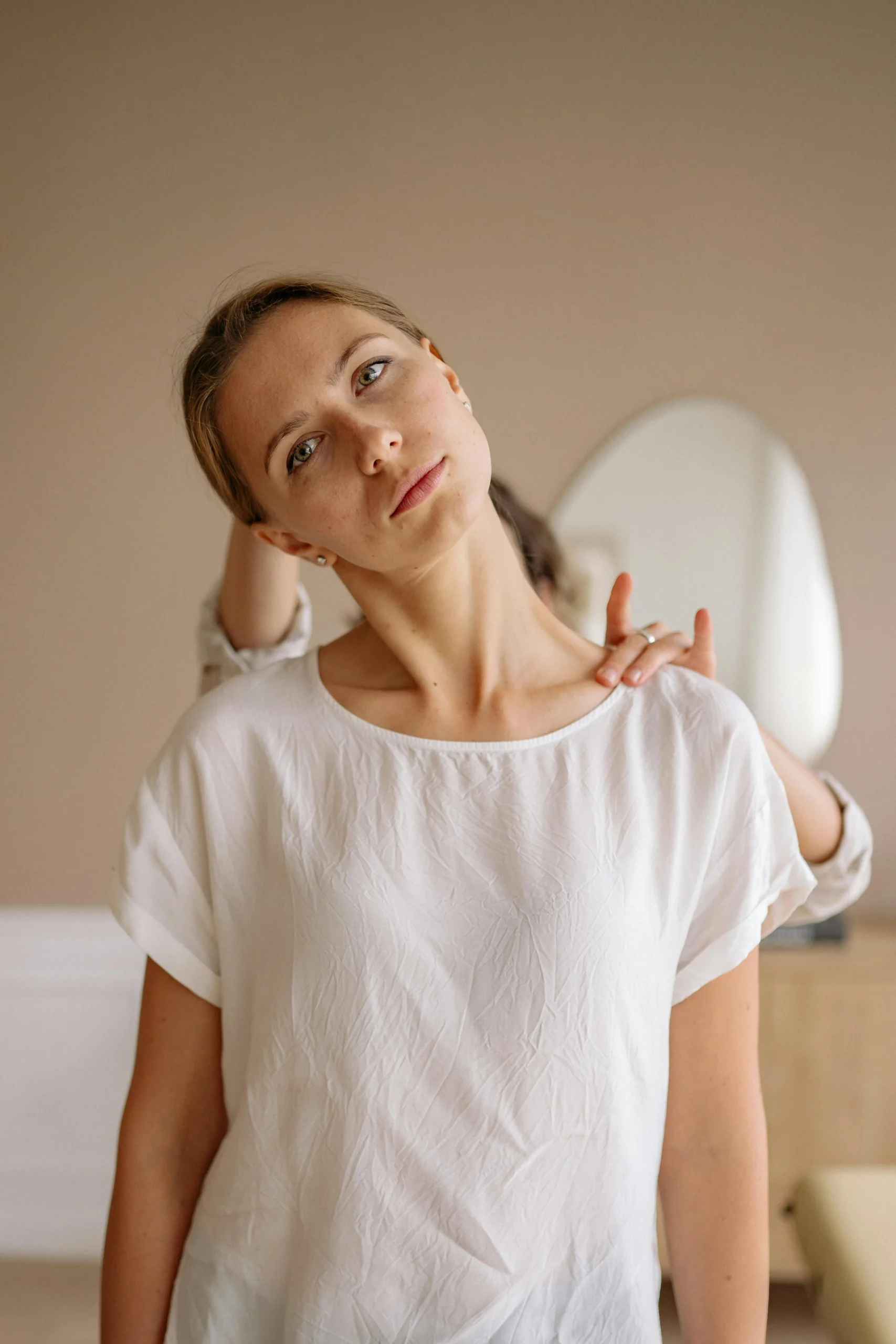 A woman during her session with her chiropractor for neck pain.
