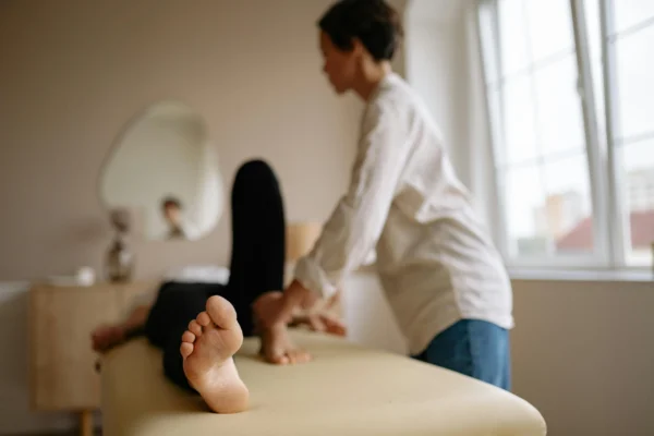 A patient during her session for her knee pain.